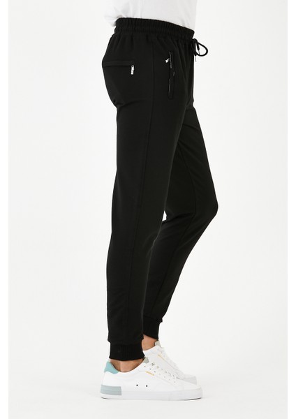 Erkek Eşofman Altı Dar Paça Bel Kısmı Lastikli Arka Cepli Paçası Lastikli Fermuarlı Kompak Penye modelleri