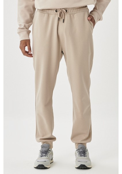 Erkek Bej Standart Fit Normal Kesim Beli Ve Paçası Lastikli Rahat Spor Eşofman Altı