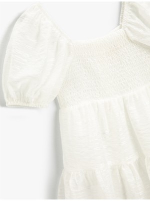 Koton Kız Çocuk Balon Kollu Kare Yaka Pileli Lastikli Volanlı Uzun Beyaz Elbise