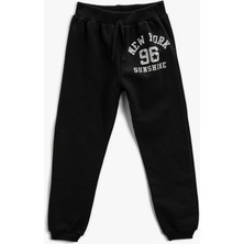 Koton Kız Çocuklar İçin Baskılı Belden Bağlamalı Jogger Eşofman Altı Siyah Renk 7 - 8 Yaş