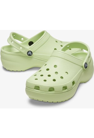 mint green crocs with fur