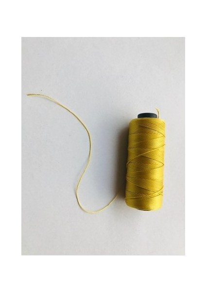 Makaralı, Sarırenk Tesbih İPİ...200 Metre , 80 GRAMDIR...%100 Polyester Naylon Iptir...0,6 mm Kalınlığındadır.....