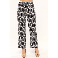 Disentis Modest Yaprak Desenli Beli Lastikli ve Ip Detaylı Boru Paça Baskılı Saten Siyah Kadın Pantolon