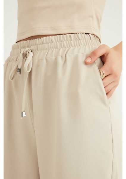 Taş Beli Lastikli Bol Paça Pantolon fırsatları