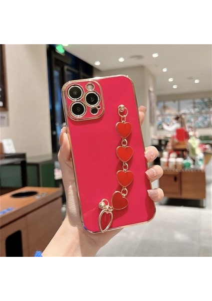 Apple iPhone 14 Uyumlu Kılıf Kamera Korumalı Parlak Gold Kenar Kalpli Bileklik Toka Tutacak
