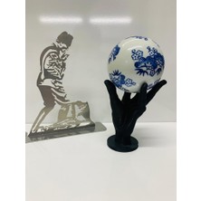 Karacan Hand Holding Globe