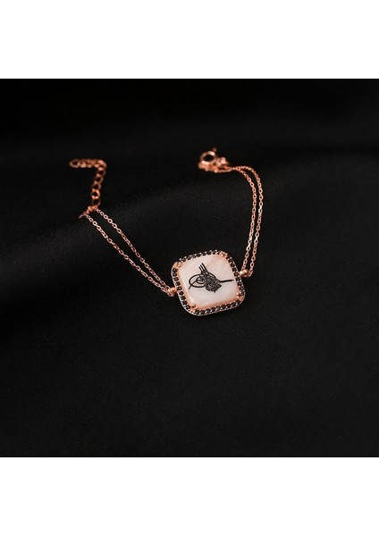 Zirkon Taş Süslemeli Tuğra Desenli Gümüş Bileklik Rose Rengi