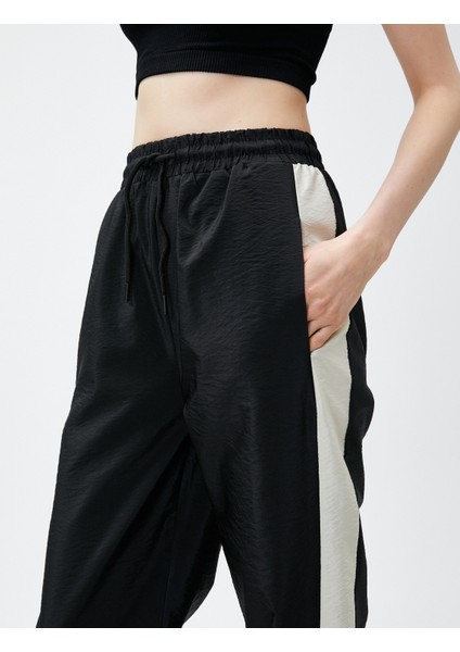 Jogger Paraşüt Pantolon Yanı Çizgili indirimleri