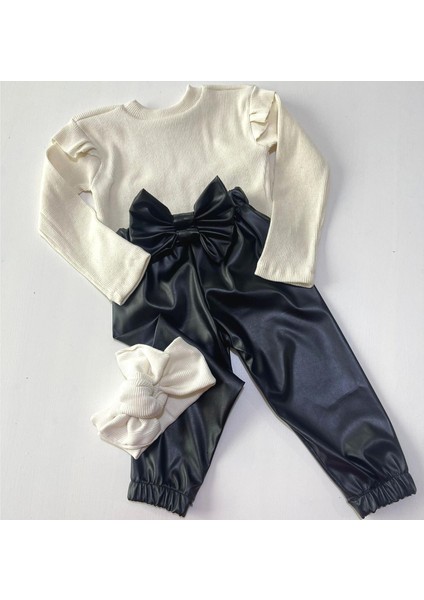 Kız Çocuk, Siyah Deri Fiyonk Detaylı Pantolon, Krem Omuzu Fırfırlı Badi ve Saç Bandı Takımı fırsatları