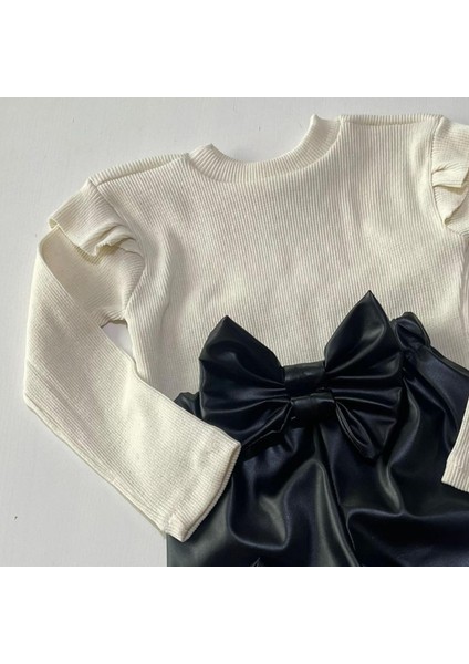 Kız Çocuk, Siyah Deri Fiyonk Detaylı Pantolon, Krem Omuzu Fırfırlı Badi ve Saç Bandı Takımı fiyatları