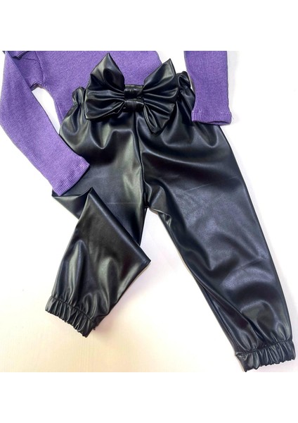 Kız Çocuk, Siyah Deri Fiyonk Detaylı Pantolon, Mor Omuzu Fırfırlı Badi ve Saç Bandı Takımı. indirimleri