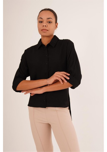 23133339 Ön Kısa Arka Uzun Düğme Detaylı Kapri Kol Gömlek Siyah fiyatları