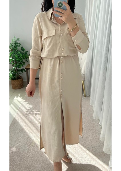 GOLD DÜĞME DETAYLI KUŞAKLI UZUN KREM ELBİSE fiyatları