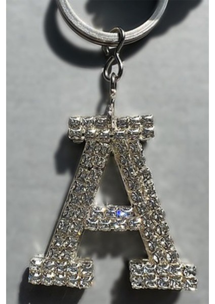 Gümüş Baget & Gümüş Disko Top & Gümüş Harf & Beyaz Tüy Anahtarlık modelleri