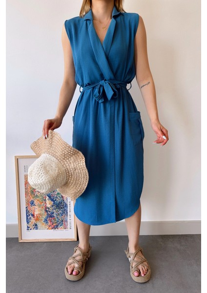 Kadın Indigo Kalın Askılı, Kruvaze Yaka, Düz Desen, Aerobin Yırtmaçlı, Kemerli Midi Elbise fırsatları