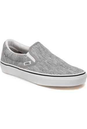 gray and white slip on vans
