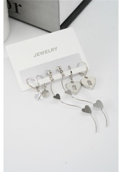 Kadın 6.5 cm Zigzag Sallantılı ve Sedefli Kalp Model 6'lı Küpe Seti modelleri