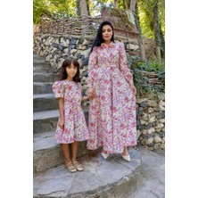 Küçüğüm Butik Tesettür Turuncu Pastel Çiçekli Boyundan Bağlamalı Kloş Anne Kız Kombini (Tekli Satılmaktadır)