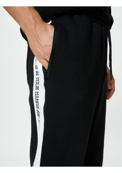 Jogger Eşofman Altı Slogan Baskılı Beli Bağcıklı Fermuar Cepli