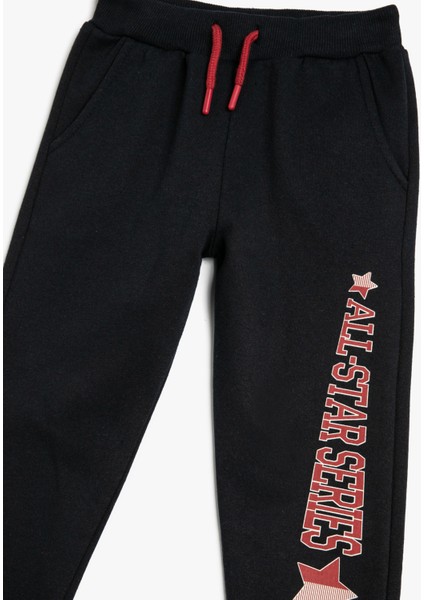 Jogger Eşofman Altı Beli Bağlamalı Cepli Slogan Baskılı Şardonlu modelleri