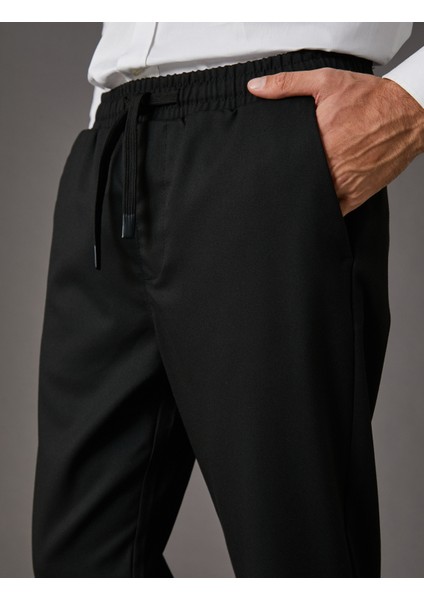 Kumaş Pantolon Slim Fit Beli Bağcıklı Cep Detaylı Bilek Boy indirimleri