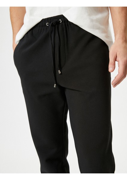 Kumaş Pantolon Beli Bağcıklı Slim Fit Cep Detaylı indirimleri