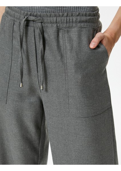 Şahika Ercümen x Koton - Beli Bağcıklı Bol Paça Pantolon indirimleri