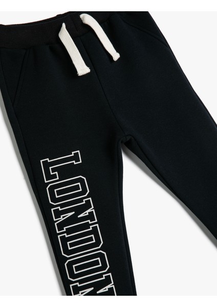 Jogger Eşofman Altı Slogan Baskılı Cepli Beli Bağlamalı Şardonlu modelleri