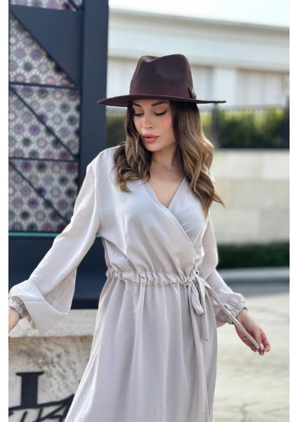 Kadın Bej Kruvaze Yaka, Yırtmaçlı, Beli Kuşaklı, Kol Bilekleri Lastikli, Salaş, Uzun Elbise fiyatları