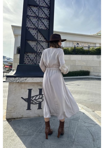 Kadın Bej Kruvaze Yaka, Yırtmaçlı, Beli Kuşaklı, Kol Bilekleri Lastikli, Salaş, Uzun Elbise indirimleri