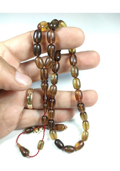 Iskeçeli Cemil Usta Işi Imzalı Ateş-I Kehribar Tesbih Sertifikalı No 3843 indirimleri