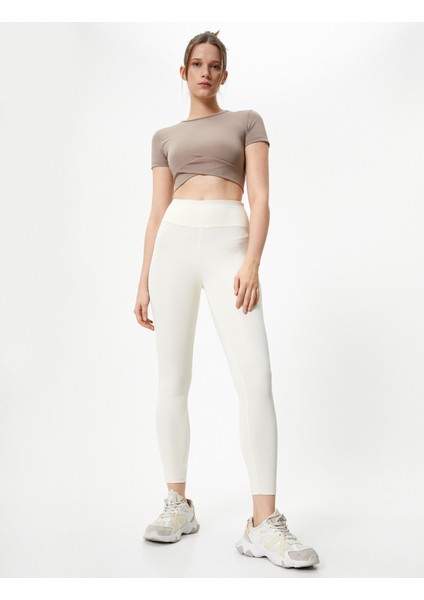 Spor Crop Tişört Kısa Kollu Bisiklet Yaka Asimetrik Kesim Slim Fit fiyatları