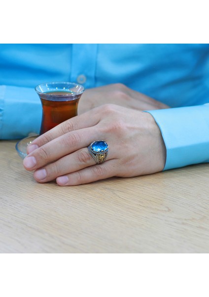 Faset Kesim Turkuaz Zirkon Taşlı Oval Tasarım Grek Süslemeli 925 Ayar Gümüş Erkek Yüzük modelleri