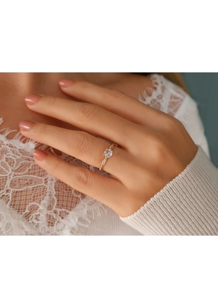 Toplam 0,75 Karat Pırlanta ve Beyaz Topaz Tektaş Yüzük 0402R0005 indirimleri