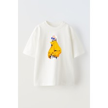 Nmg Tekstil Unisex Beyaz Oversize Pamuk Beyaz Saçlı Sarı Montlu Kız Baskılı Örme T-Shirt