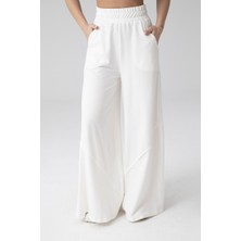 Deseo Boutique Kadın (Astarsız -Hafif Iç Gösterir) Ekru Renk Asimetrik Kup Detaylı Geniş Paça Örme Pantolon