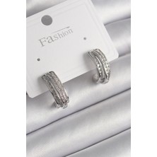 Clariss Pirinç Gümüş Renk Zirkon Taşlı Yarım Halka Model Kadın Küpe