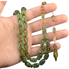 Burhan sağlam Burhan sağlam  Sistem Püsküllü 13x8 mm Oyma İşçilikli İmzalı Ateş Kehribar Tesbih