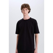 DeFacto %100 Pamuk Oversize Geniş Kalıp Bisiklet Yaka Basic Düz Kısa Kollu Siyah Tişört E6885AXNS