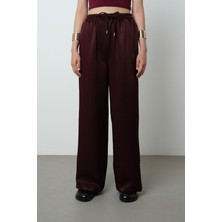 Orfeonegro Kadın Düz Renk Parlak Kumaş Bol Paça Beli Lastikli Pantolon