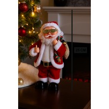 Dodomar 25 cm Gözlüklü Hareketli Pilli Sesli Noel Baba – Mini Özel Tasarım Yılbaşı Dekor Figürü