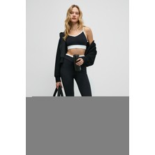 Urban Beat Glıpsen Kadın Yumuşak ve Esnek Dokulu Kontrast Biyeli Asimetrik Kemerli Ispanyol Paça Siyah Tayt