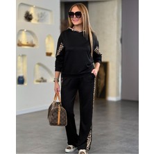 Stelol Kadın Kapüşonlu Leopar Detay Sweat ve Yüksek Bel Yanları Leopar Şeritli Bol Paça Pantolon Ikili Takım