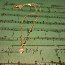 Nota Figürlü Zirkon Taşlı Çelik Gold Renk Kolye