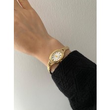 Elifra Kadın Gold Kaplama Quartz Kol Saati - Yanları Zirkon Taşlı Oval Kasa Lüks Bileklik Saat