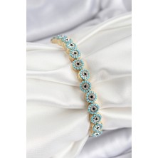 Hatıra Kutusu Pirinç Zirkon Taşlı Turkuaz Nazar Model Gold Renk Lastikli Kadın Bileklik - Lisinya