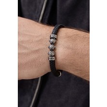 Çelik Detaylı Siyah Örgü Deri Erkek Bileklik – Leopar Figürlü Maskülen Tasarım