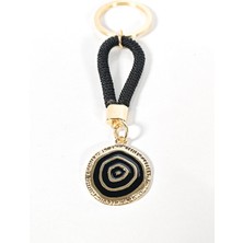Moncuk Design Siyah Örgü Ipli Nazar Motifli Yuvarlak Metal Anahtarlık – Modern, Güçlü ve Şık Tasarım