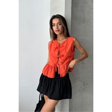 Caddebostan Moda Kadın Önden Üç Fiyonk Bağlamalı Kolsuz Peplum Bluz