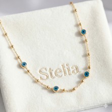 Stelia 316L Çelik Gold - Altın Renk Nazarlı ve Topçuklu Model Kadın Kolye